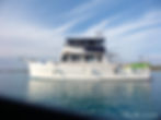 White trawler on calm water from the trawler photo gallery.