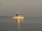 Trawler photo gallery: yacht anchored in calm water at dusk