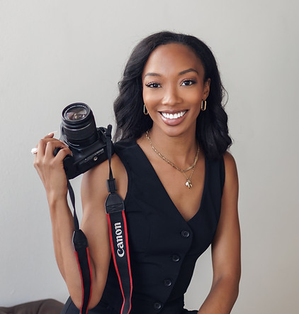 India Williams, owner of IndyPhotography LLC, posing confidently during a branding shoot.