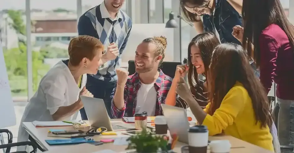 A group of professionals collaborating around a table in a meeting.