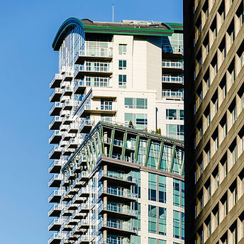 Tall residential skyscraper with many balconies against sky in Denver