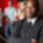 Security guard in suit near socializing guests