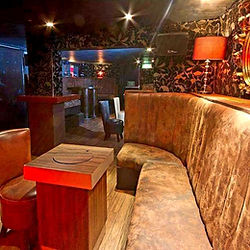 The Penguin Room interior with cozy booth seating.