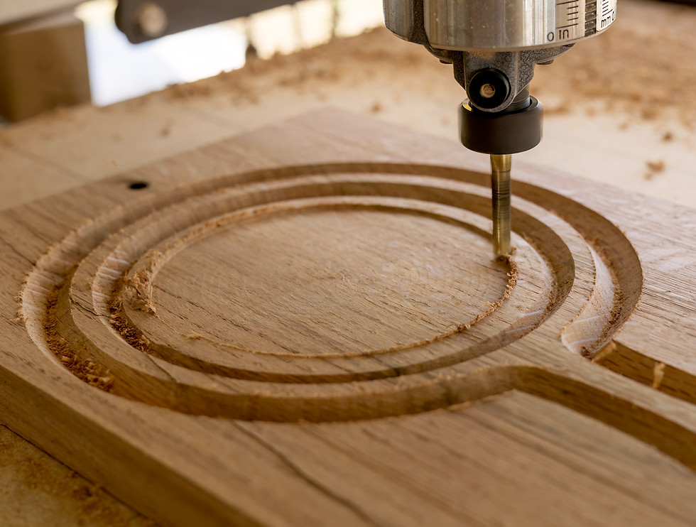 vecteezy_a-cnc-machine-routing-a-circle-on-an-oak-wood-board_19764429.jpg