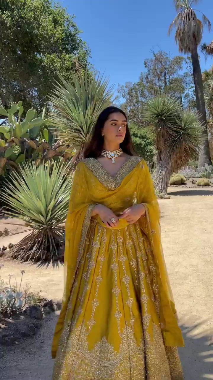 Thumbnail: Ethnic Bridal Wear Yellow And Gold Colour Hand Embroidered Lehenga Set