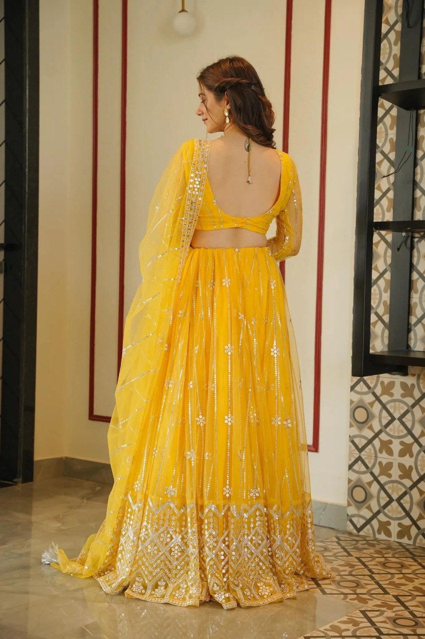 Thumbnail: Yellow Soft Net Sequence Embroidery Work Haldi Ceremony Lehenga Choli