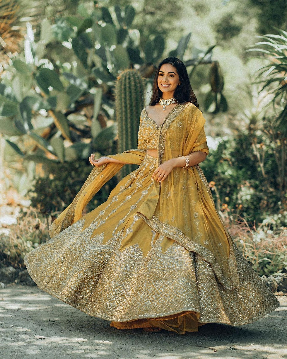 Thumbnail: Ethnic Bridal Wear Yellow And Gold Colour Hand Embroidered Lehenga Set