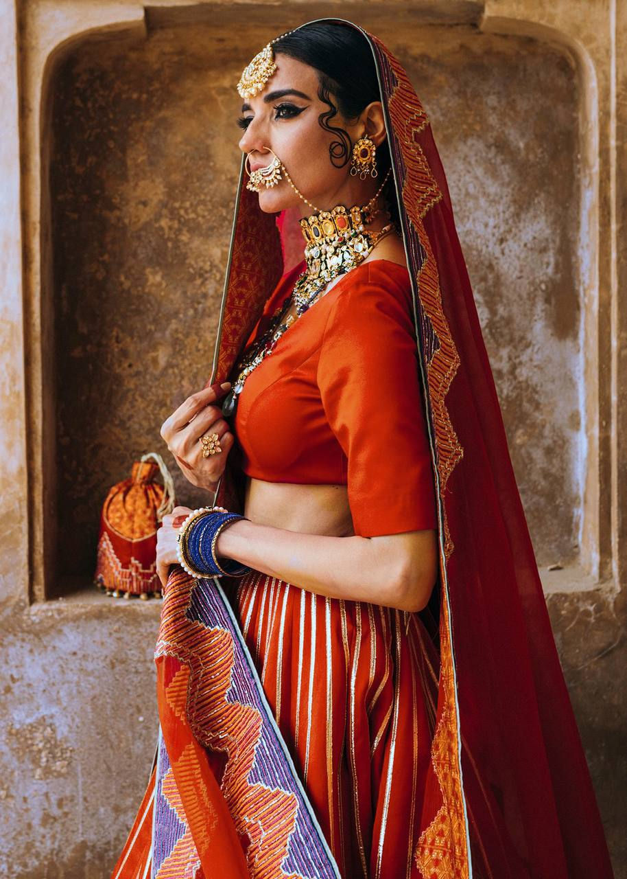 Thumbnail: Rajasthani Style Red Colour Wedding Wear Lehenga Set In Zari Embroidery Work