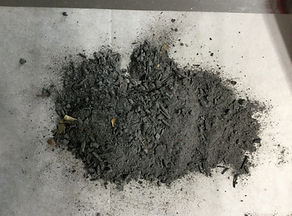 ashes from the Harrari Harp Workshop fire