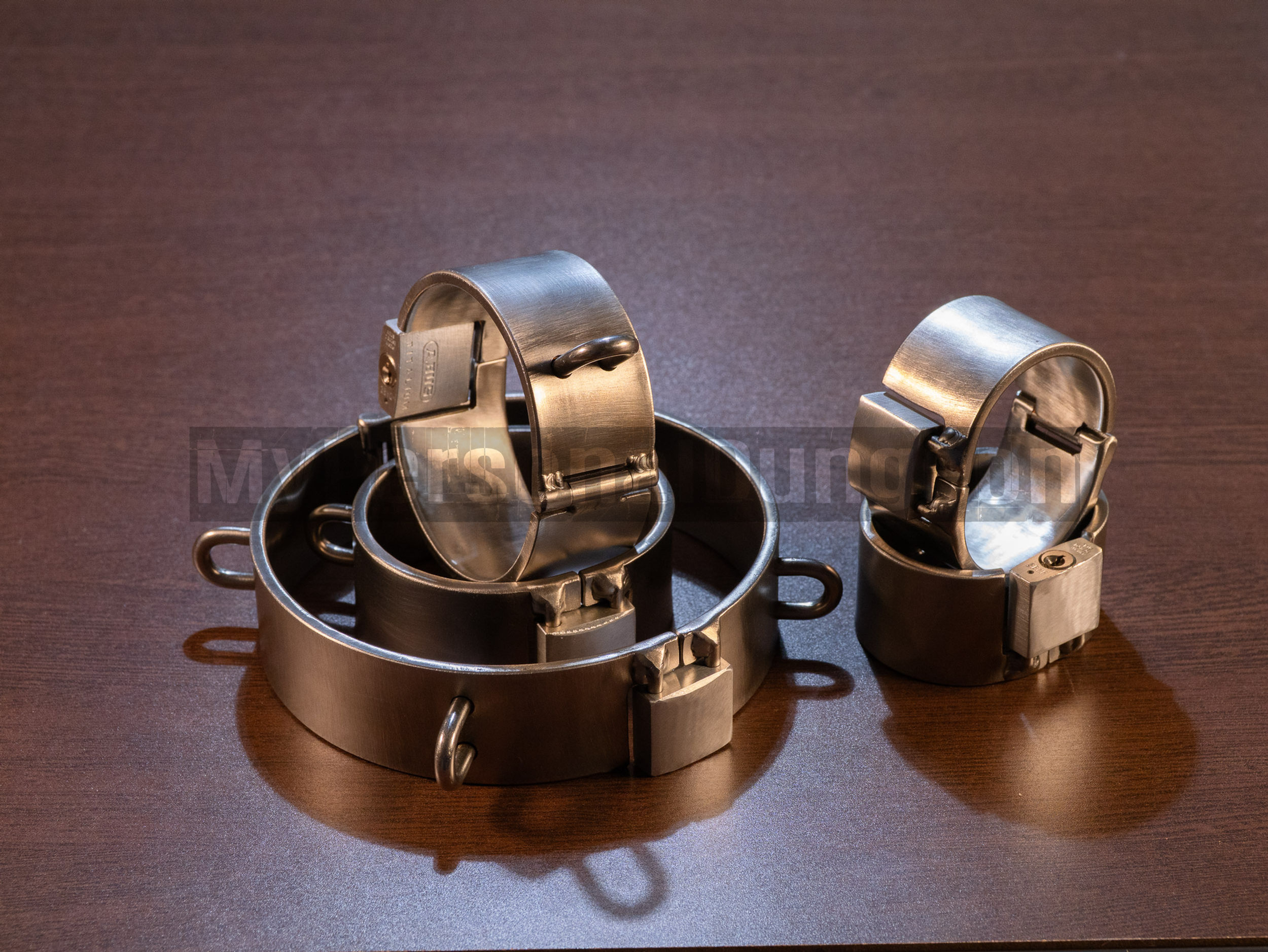 Heavy stainless steel shackles 4cm wide. 8 attachment loops, permanent padlocks