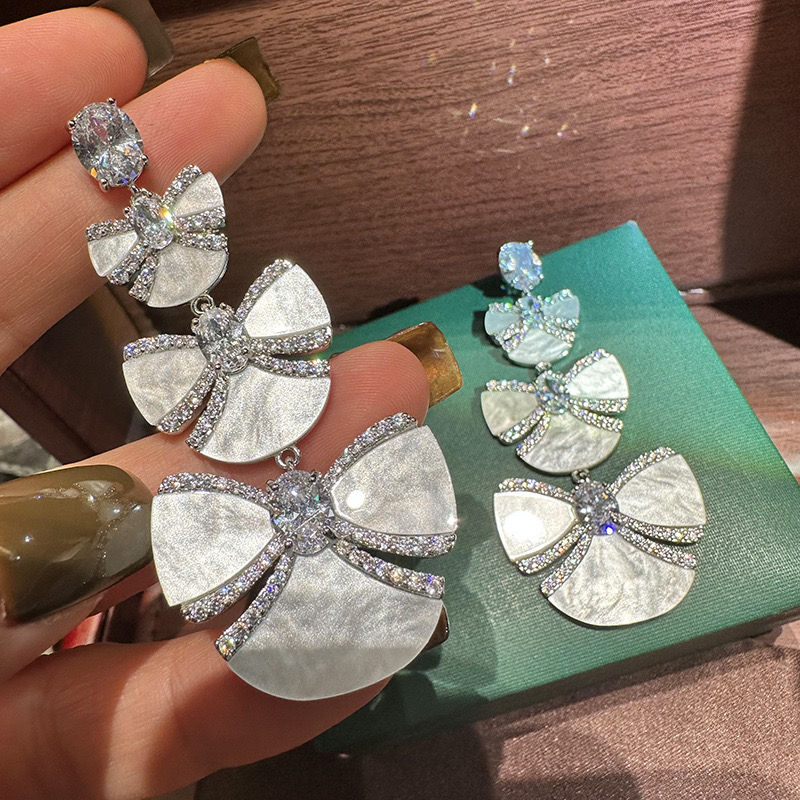 Thumbnail: Three Tiered  Bow Earrings