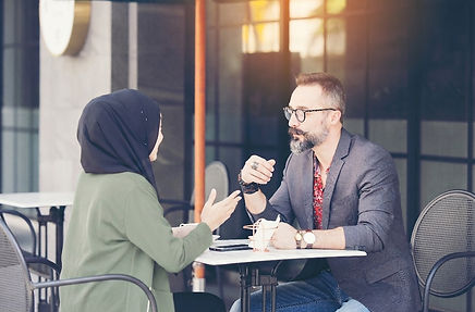 asian-muslim-businesswoman-coffee-shop-talking-customer