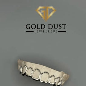 A gold dental grill in a curved shape