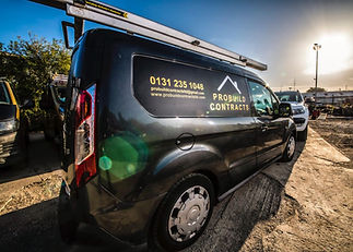 A black van with "Probity Contracts"