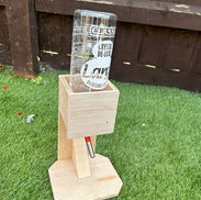 Wooden base with glass bottle