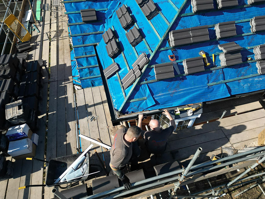 Aerial view of a home's roof before roof leak repair.