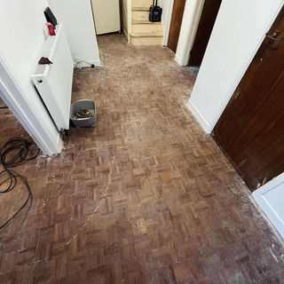 Hallway with scuffed wooden floor