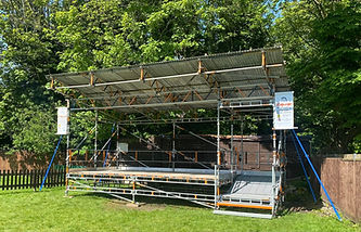 Outdoor stage structure under trees