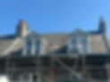 A house has scaffolding set up for renovation