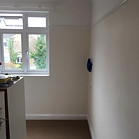 An empty room with beige walls 