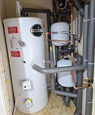 Close up of a gas boiler installation with copper pipes
