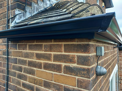 close-up image of black gutter pipe
