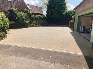resin paved outdoor space with greenery