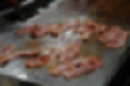 Cooking strips of bacon
