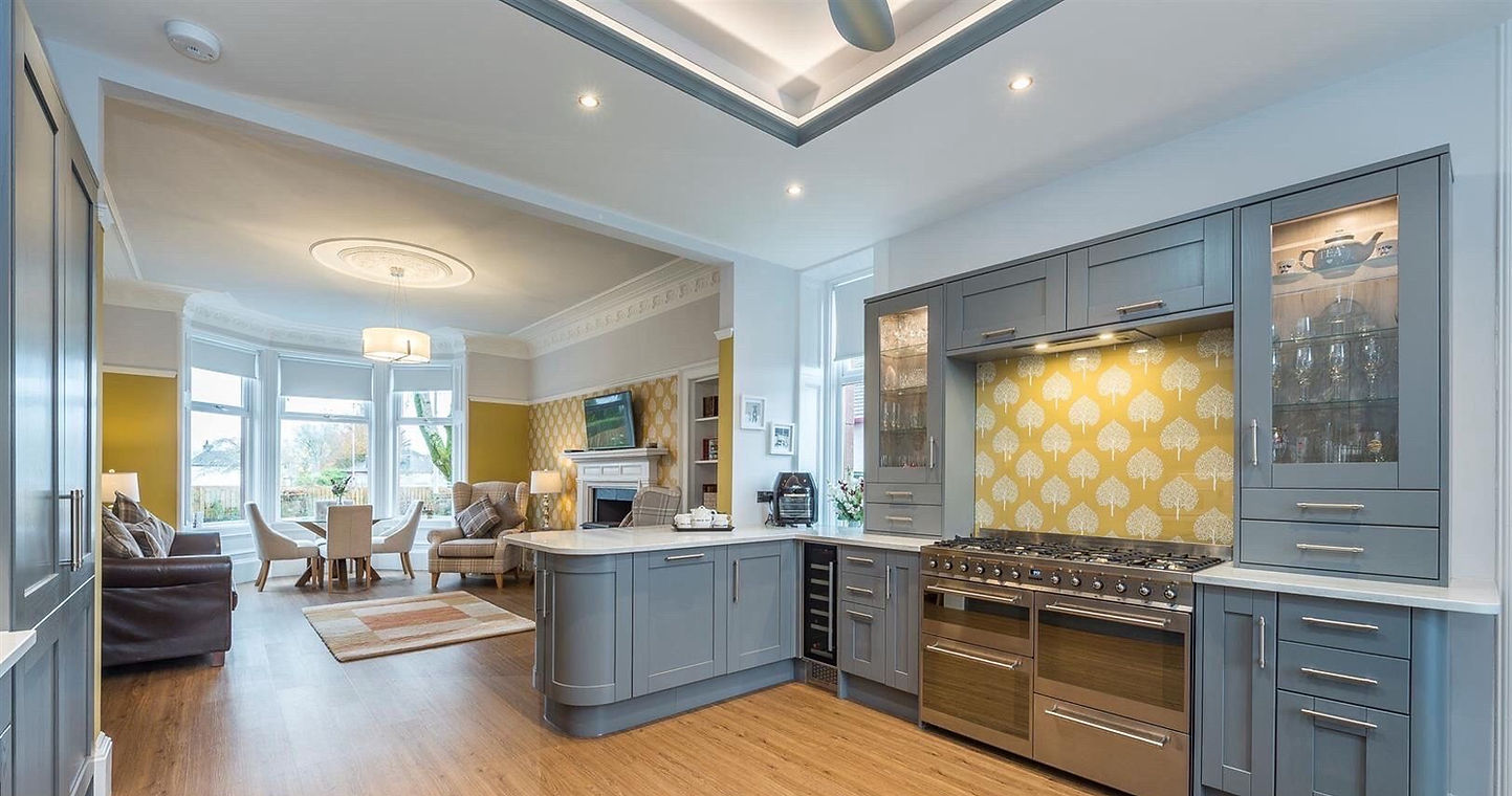 A light grey and yellow kitchen
