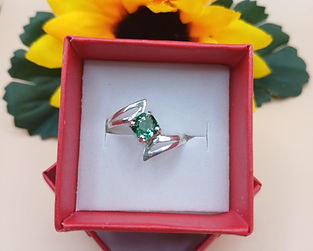 Silver ring with green gem