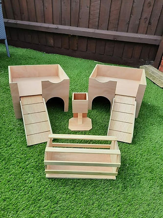 Wooden play structures on grass