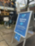 Sign outside cafe of the wellbeing walk-in drop-in session
