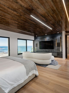 A custom-built TV unit, creating a bedroom focal point. Designed and installed by Kitchen Emporium