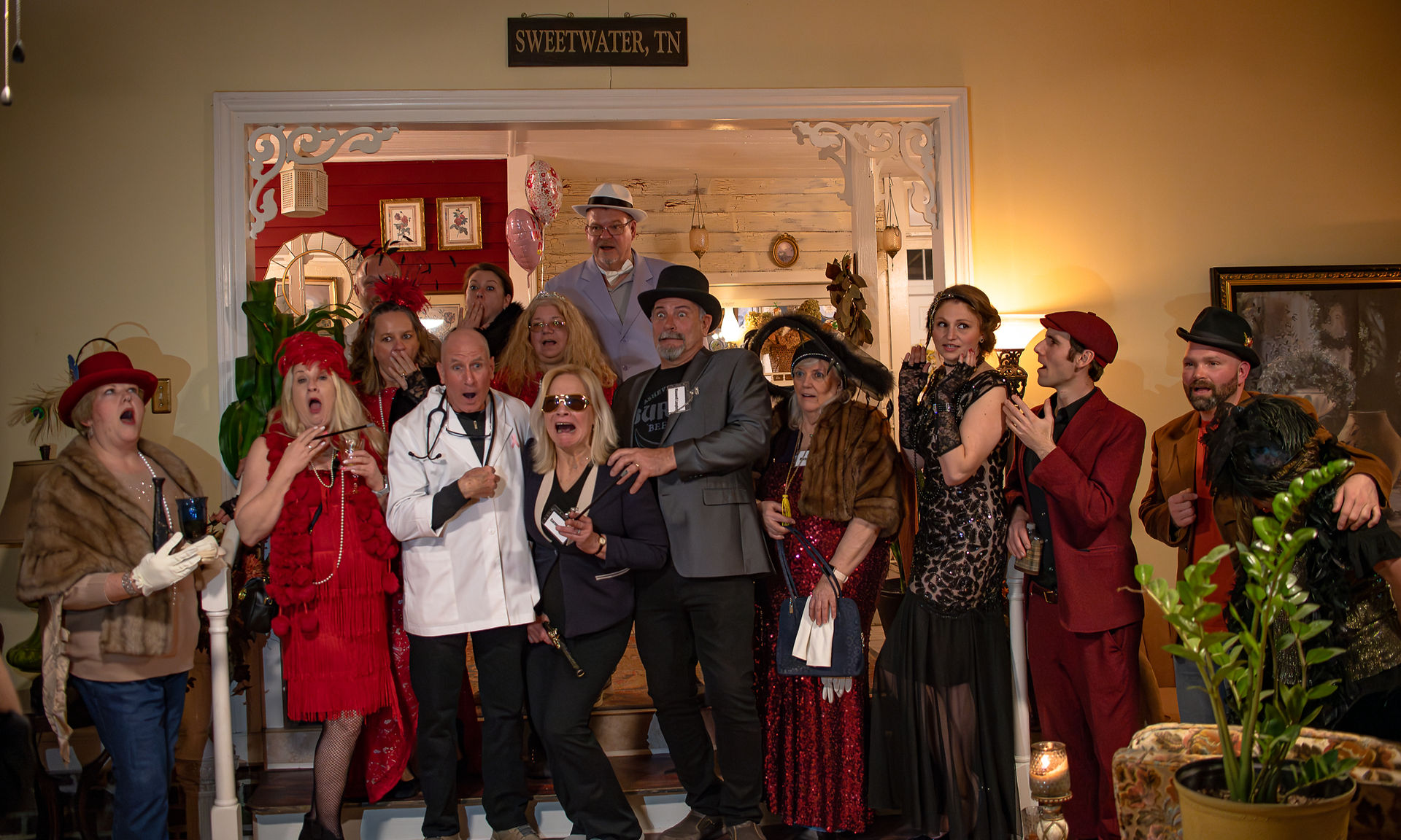 photo of entire murder mystery dinner party, acting scared