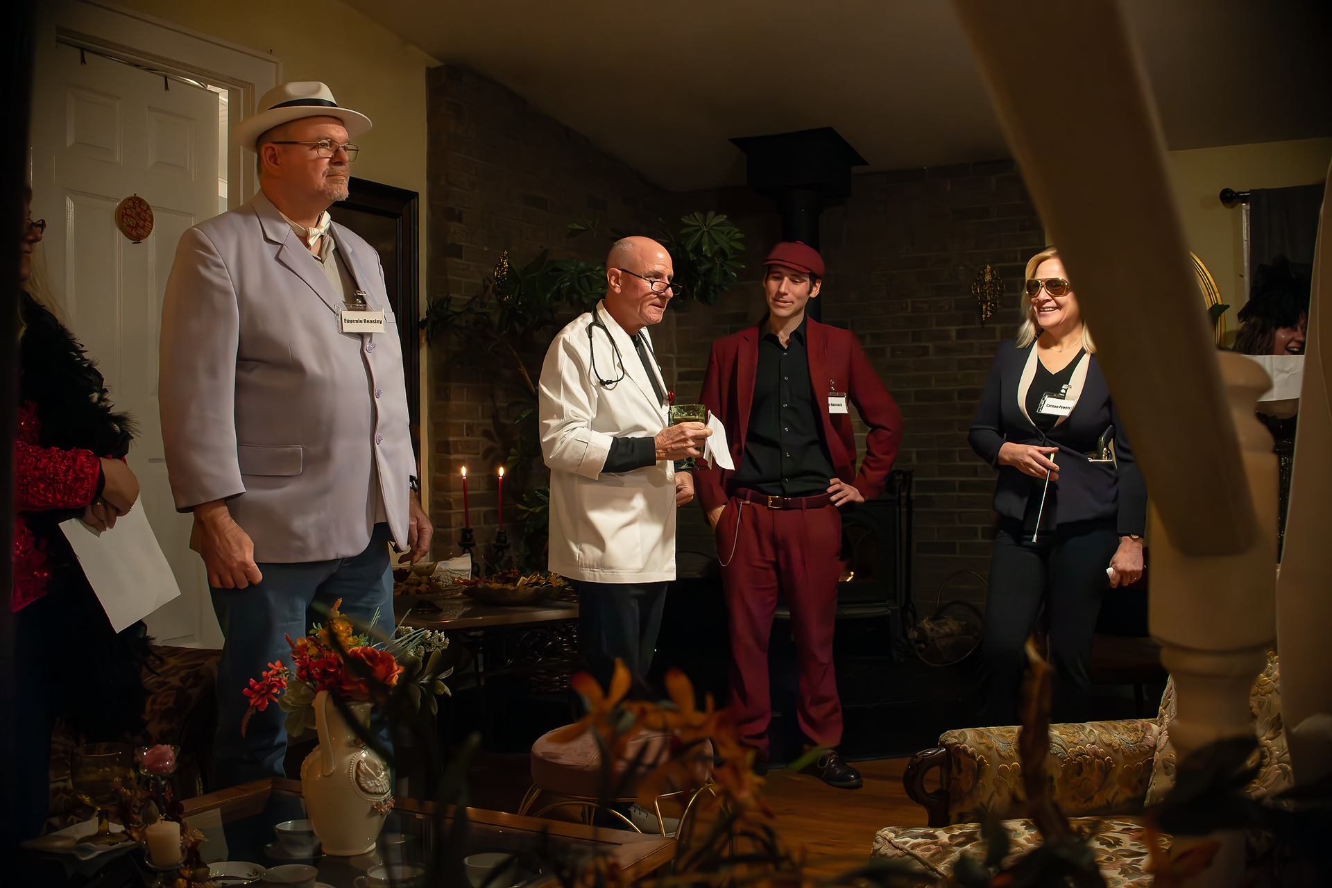 creative shot of murder mystery dinner guests taken from underneath a stair railing