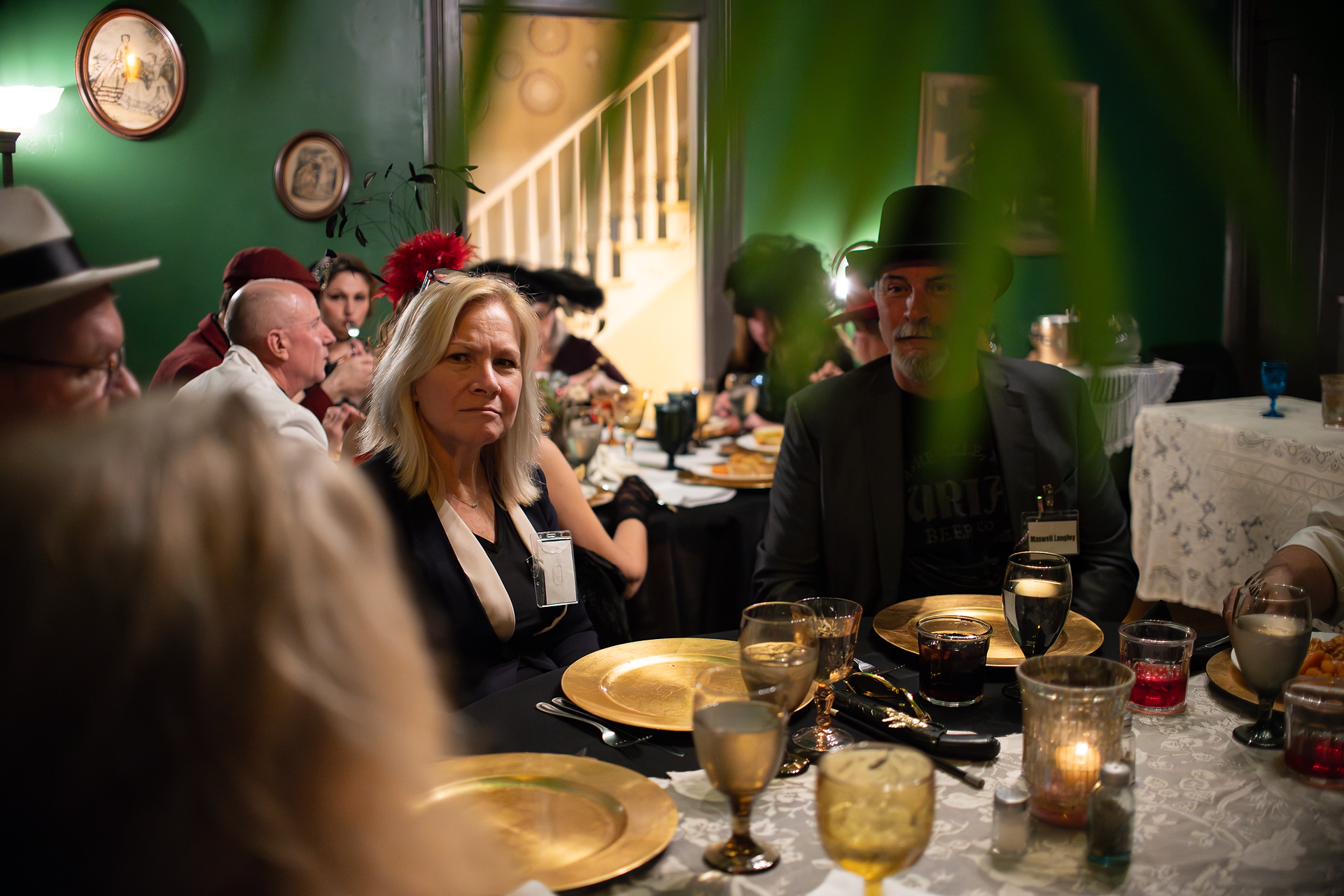 creative shot that shows a little mystery during the dinner at a murder mystery dinner