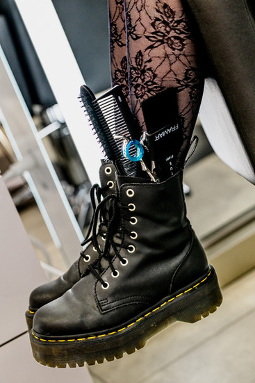 close up of boots with hairs tuff inside them. branding photo for Athens, Tennessee cosmetologist