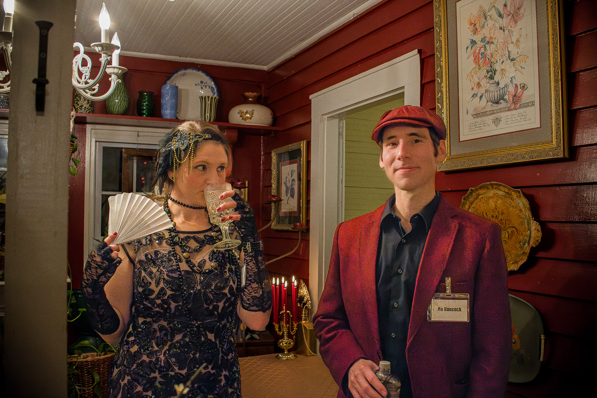 photo of 1920's murder mystery dinner guests walking away from speakeasy door at Whistlestop Manor in Sweetwater, Tennessee