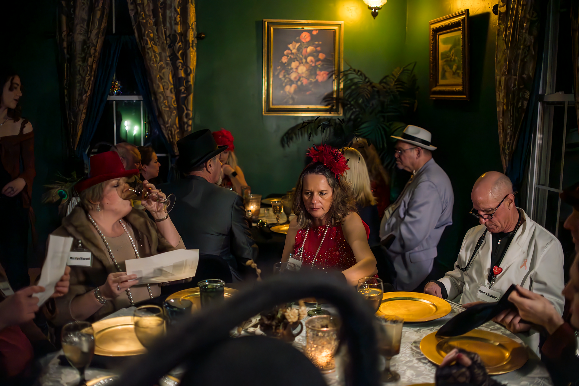 branding photo showing scene at dinner table at murder mystery dinner