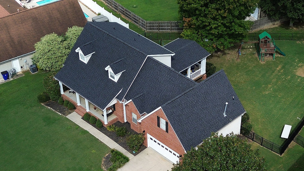 Drone/aerial photo of a home owners roof after getting it mostly paid for by their insurance after a roof inspection with Appalachian Lens.