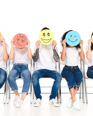multicultural-friends-in-blue-jeans-sitting-on-cha-2023-11-27-05-35-08-utc (2).jpg