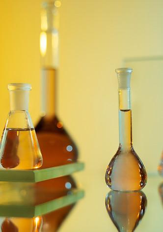 laboratory-glassware-with-orange-liquid-arrangement_edited.jpg