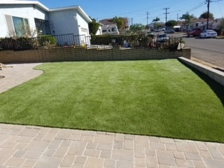 turf, pavers, and retraining wall 