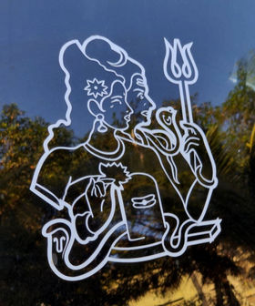 Sticker of Shiva and Parvati on the back of a car.jpg