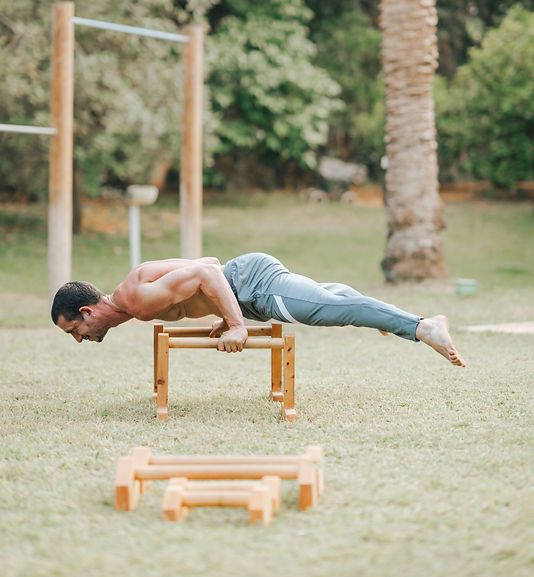 A man performing a 90 degree handstand push up