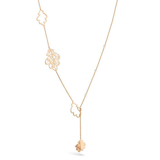 Front view of 18k rose gold necklace set with three white diamonds and golden oak leaves.