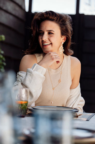 Women wearing the OAK jewellery collection: oak necklace and the Oak earrings all in 18k rose gold set with white diamonds