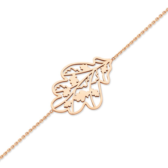 18k rose gold chain with an golden charm set in the middle in the shape of an oak leaf