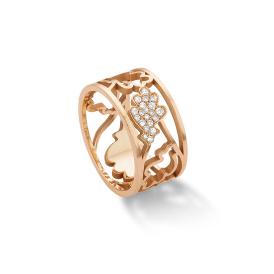 View from side on rose gold ring with oak shaped pattern pavé set with diamonds