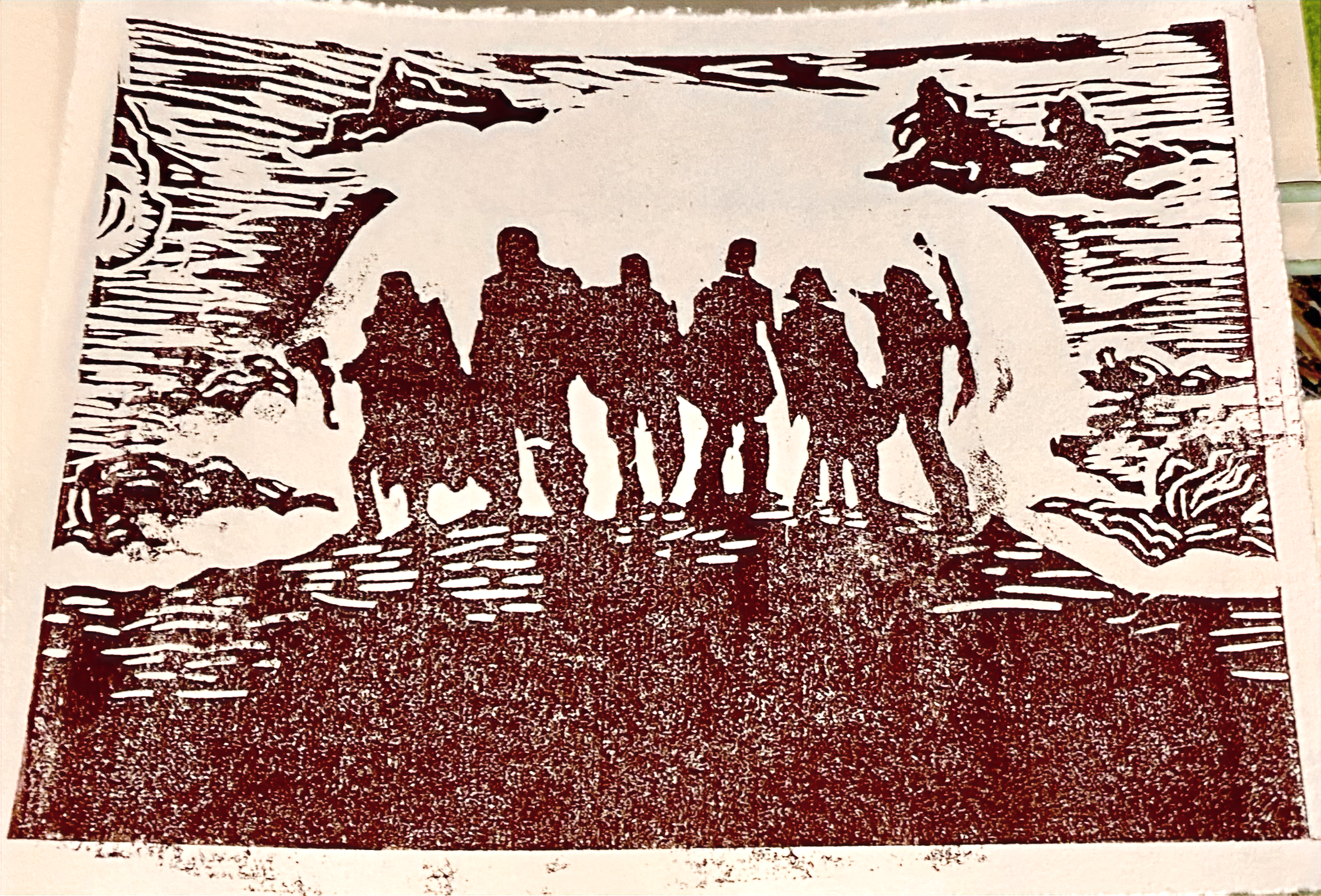 Linocut print of six figures on a hill at sunset